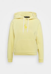 Gul hoodie i mjukt material, med en kenguruficka och vita dragband. Broderad logotyp på bröstet.