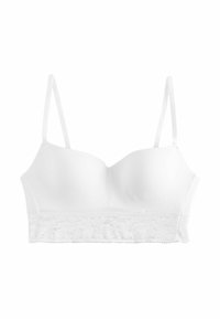 Reggiseno bianco con spalline sottili regolabili, realizzato in tessuto liscio e con una fascia decorativa in pizzo lungo il fondo.