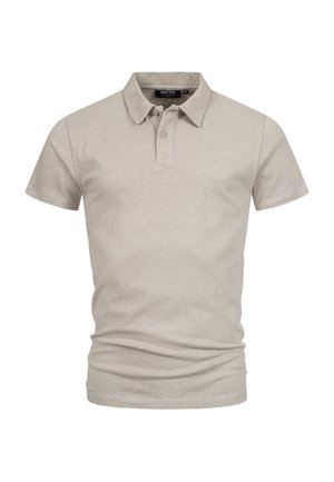 Polo shirt beige clair en coton doux. Présente un col classique, une patte de boutonnage à deux boutons et un logo brodé discret sur la poitrine.