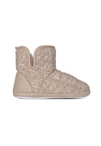 Zapatillas de punto beige con un patrón texturizado, diseño de tobillo bajo y un interior suave. Cuentan con una suela resistente y una ligera altura.