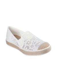 Zapato blanco tipo zueco con diseño floral en encaje, punta redonda de yute trenzado y suela texturizada. Material ligero y transpirable.