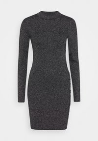 Robe noire à manches longues côtelées avec un col haut. Elle présente un tissu texturé avec des paillettes argentées et un détail de logo sur le côté.