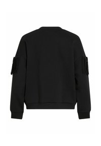 Felpa nera corta con una superficie liscia, vestibilità oversize e dettagli con frange sulle maniche. Presenta un collo rotondo e polsini a coste.