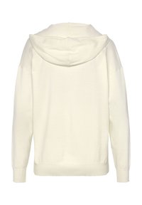 Hoodie color crema con un ampio cappuccio, polsini a costine e una vestibilità rilassata. Tessuto morbido con una superficie liscia, design minimale.