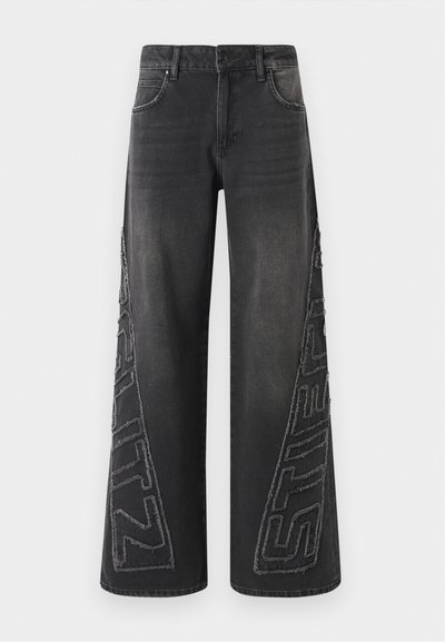Black wide-leg jeans made of denim, featuring a frayed embroidered graphic on the sides and traditional five-pocket design.