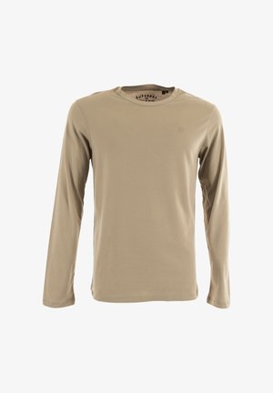 Maglietta a maniche lunghe in cotone beige. Presenta un collo a giro e un logo discreto sul petto. Tessuto morbido con una vestibilità rilassata.