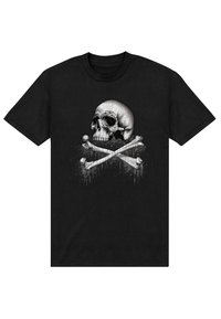 En svart t-shirt med en grafik av ett dödskalle och korslagda ben i vitt och grått, detaljerad med sprickor och stänkeffekter.
