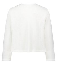 White knitted sweater, cropped design, long sleeves, open weave texture, and a round neckline. Simple and lightweight construction.