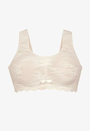 Kant bh in crème met brede bandjes, bloemenpatroon en een klein strikdetail in het midden. Golvende randen langs de onderkant.