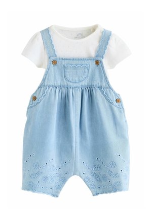 White short-sleeve baby shirt paired with light blue embroidered denim overall shorts featuring scalloped edges and wooden button details.
