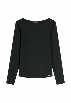 Czarna koszulka z długim rękawem i okrągłym dekoltem, z małą złotą metalową plakietką przy dolnym brzegu, prezentowana na białym tle.