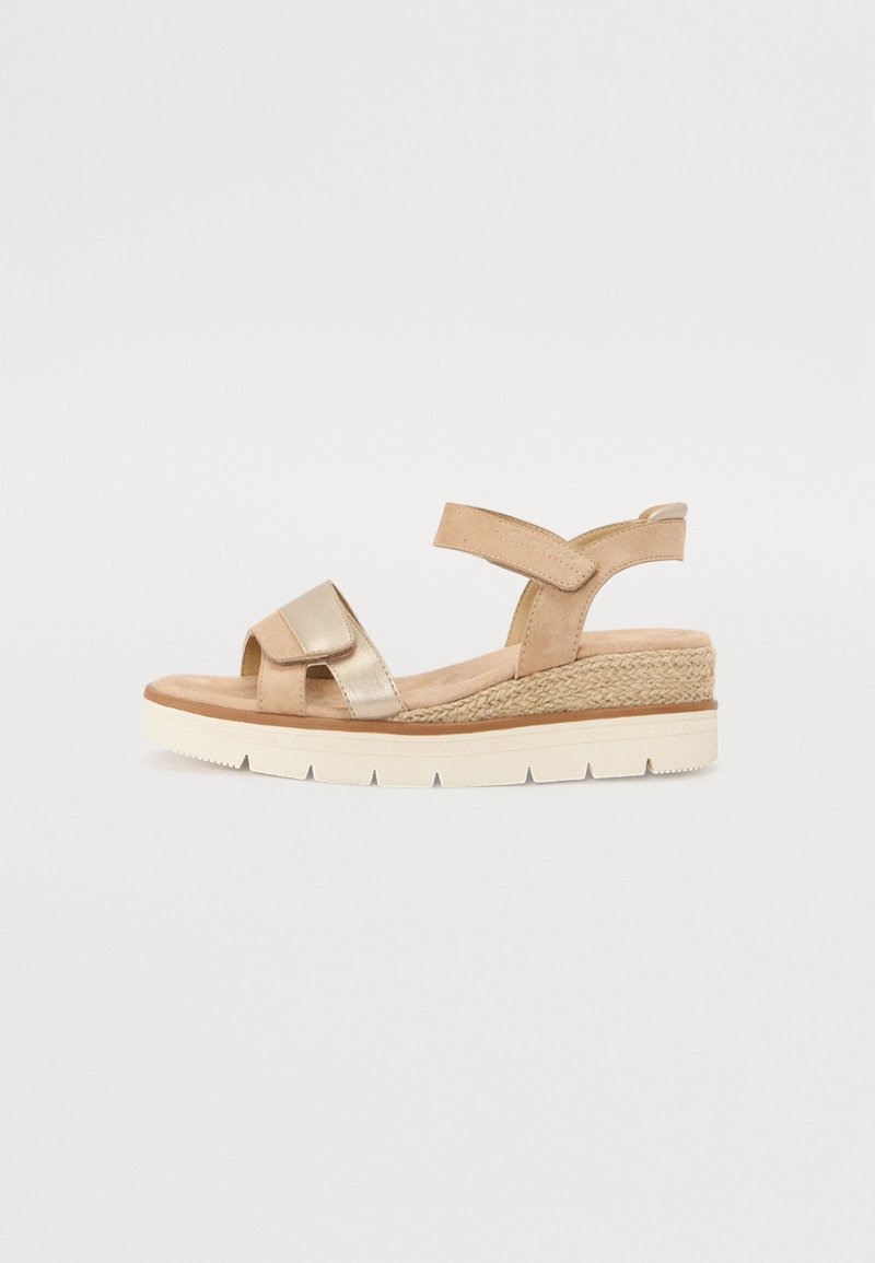 Wedge sandal with a beige and metallic gold finish, featuring cross straps, cushioned insole, and woven texture on the platform.