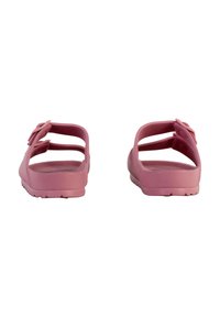 Pink rubber slip-on sandals with an open back, featuring two adjustable straps and textured soles for grip.