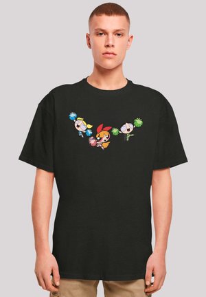Black cotton t-shirt featuring three cartoon characters holding pom-poms in vibrant colors. Crew neck and short sleeves. Casual fit.