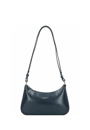 Dark blue leather handbag with a curved shape, adjustable double strap, zip closure, and silver hardware. Features a logo on the front.