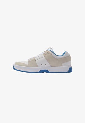 Sneaker featuring beige and white suede and leather construction, blue accents, round toe, flat rubber sole, and lace-up design.