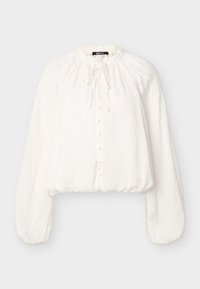 Λευκό μπλούζα μακρυμάνικη με στρογγυλή λαιμόκοψη με σούρες, κουμπιά στο μπροστινό μέρος καλυμμένα με ύφασμα, λεπτομέρεια με κορδόνι και φουσκωτά μανίκια που συγκεντρώνονται στις μανσέτες.