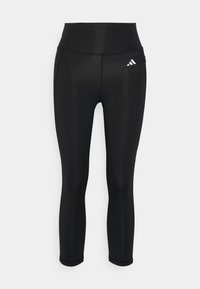 Black athletic leggings with a high waistband. Made of smooth, stretchy material featuring a small white logo on the left thigh.