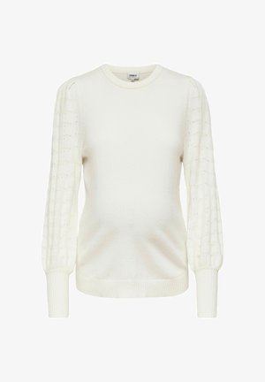 Bela pletena jopica z okroglo ovratnikom, teksturiranimi puff rukavi in rebrastimi manšetami. Telo je gladko, kar zagotavlja sproščen kroj.