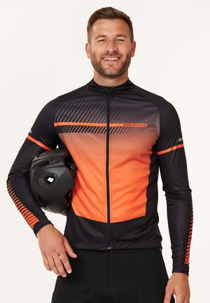 Black and orange cycling jersey with a geometric pattern, zip closure, and long sleeves. The fabric appears smooth and stretchy.