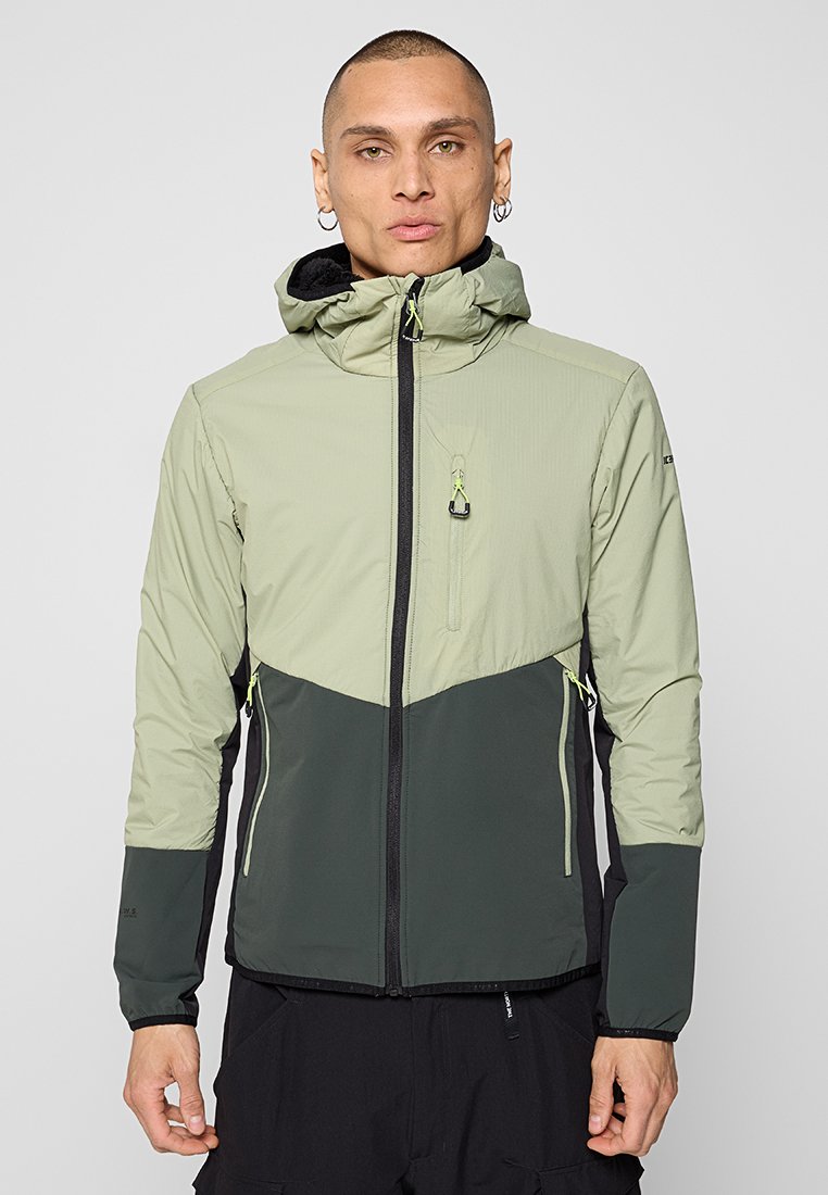 Veste imperméable vert clair et vert foncé avec capuche, présentant un zip frontal, une poche poitrine et des détails ajustables avec cordon.