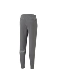 Pantalones de chándal grises con una cinturilla elástica, que cuentan con bolsillos laterales y un logo en la parte inferior de la pierna. Tela suave con un ajuste estilizado.
