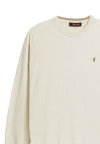 Maglione avorio realizzato in tessuto morbido, con colletto girocollo, polsini a coste e un piccolo logo marrone ricamato sul petto.