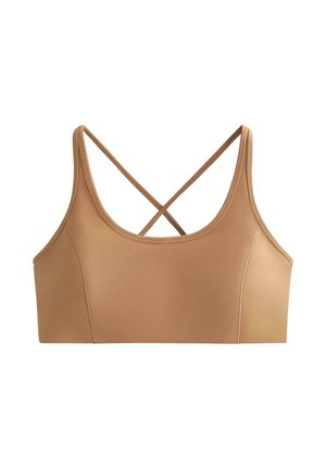 Bež športni nedrček s tankimi naramnicami, ki se križajo na hrbtu, gladkim materialom in izrezom v obliki skodelice.