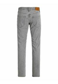 Hallhalli denim püksid sirge lõikega, millel on kaks tagumist taskut ja pruun nahkpatch vöökoha peal. Tekstuuriga kangas, tavaline õmblus.