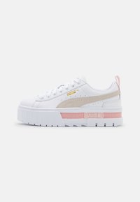 White sneaker with a textured upper and platform sole. Features gold and beige accents, pink detailing, and a secure lace closure.
