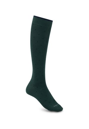 Chaussette haute vert foncé avec petits pois et bord-côte, présentée debout sur fond blanc.