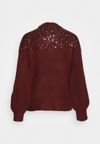 Pull bordeaux avec un col rond, des manches bouffantes et un dos orné de sequins. Texture douce et coupe décontractée.