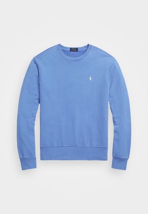 Jasnoniebieska bluza z długim rękawem i okrągłym dekoltem z małym białym logo Polo Ralph Lauren na lewej piersi.