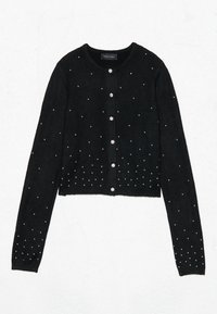 Melnā īsā kardigāna no mīksta auduma, ar mazām, izkaisītām rhinestone detaļām un pogu aizdari ar ziedu akcentu.
