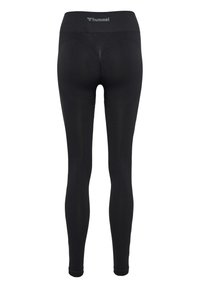 Svarta leggings med hög midja, tillverkade av elastiskt tyg. Har en slät textur och diskret märkning på midjebandet.