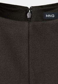 Close-up of a black garment’s back neckline with a closed zipper and a small black label showing white MNG text.