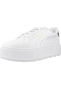 Zapatillas plataforma blancas Puma con suela de goma texturizada, parte superior sintética suave, punta redondeada, cierre de cordones y un sutil detalle del logotipo dorado.