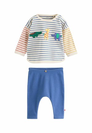 Children's outfit with long-sleeve striped shirt featuring three animal patches and solid blue ribbed pants with button detail.