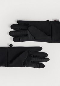 Guanti neri realizzati in tessuto elasticizzato, con aree di presa testurizzate sui palmi, dotati di chiusure regolabili ai polsi e un design elegante.