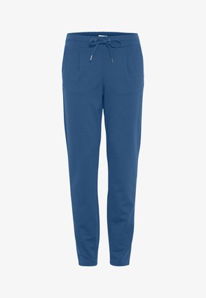 Blaue Jogginghose aus weichem Stoff, mit elastischem Bund und Kordelzug, zwei Fronttaschen und schmal zulaufenden Beinen.