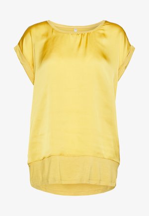 Yellow silk blouse with short sleeves, round neck, gathered detail at the neckline, and a slightly longer back hem. Smooth texture.