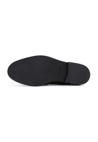 Black shoe sole, rubber material, flat design, textured surface with ribbing, logo embossed, minimalistic without additional colors or patterns.