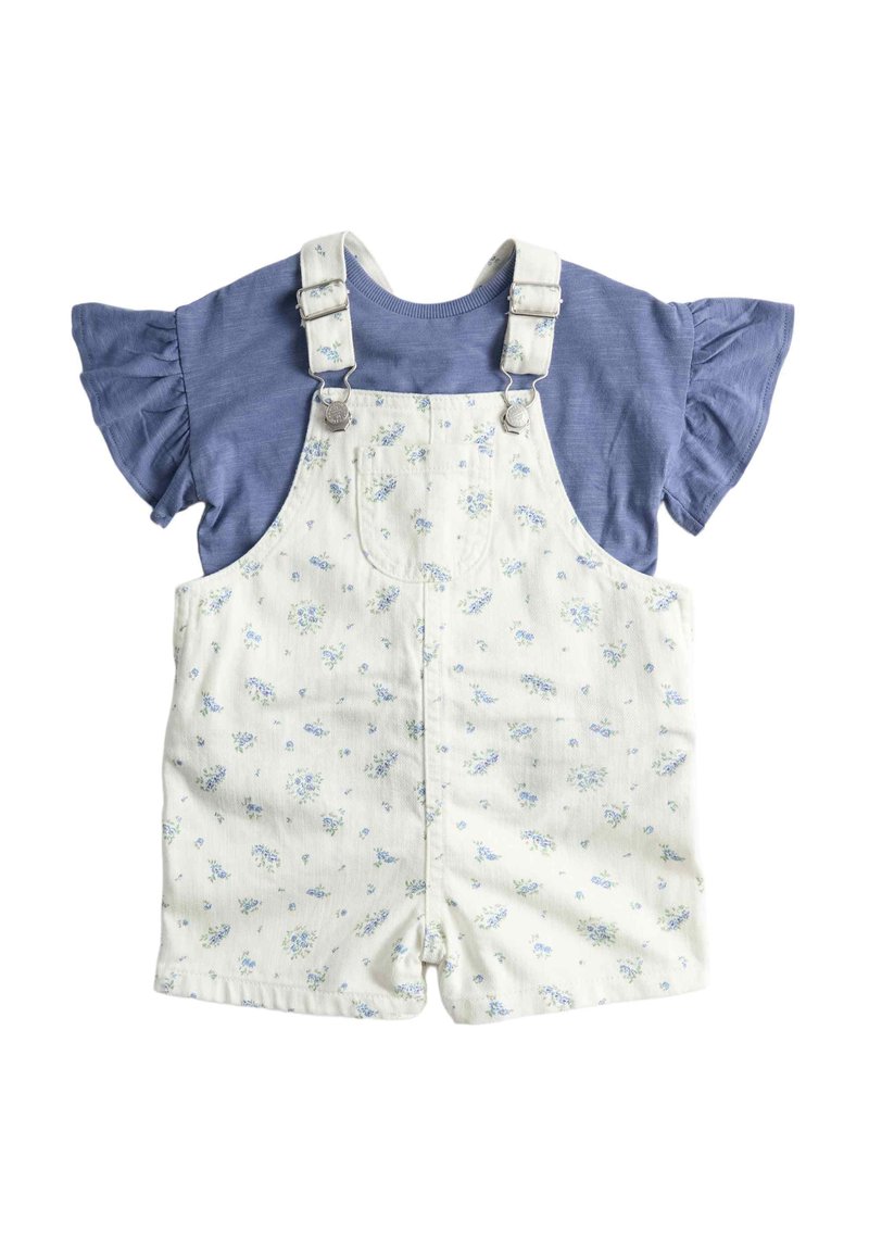 Blue short-sleeve ruffle shirt paired with white floral print short overalls featuring front pocket and adjustable straps.