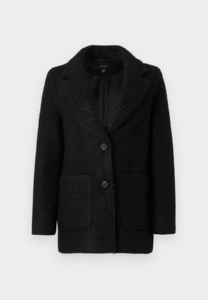 Blazer preto texturizado com colarinho em bico, apresentando dois bolsos frontais e dois fechos de botão. Interior forrado. Silhueta clássica.