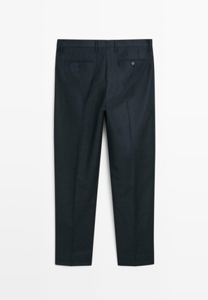 Navy dress pants with a tailored fit, featuring two back pockets, belt loops, and a crease down the front. Smooth fabric texture.