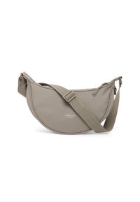 Sling bag in soft, muted beige fabric with a rounded silhouette, adjustable strap, and branded logo. Features a zip closure.