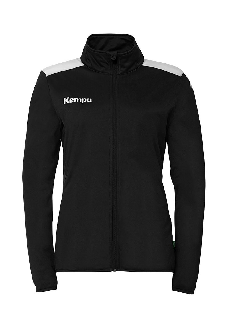 Sort jakke med høj krave, lynlåslukning og hvide accenter på skuldrene. Har "Kempa"-logoet på brystet. Glat stoftekstur.