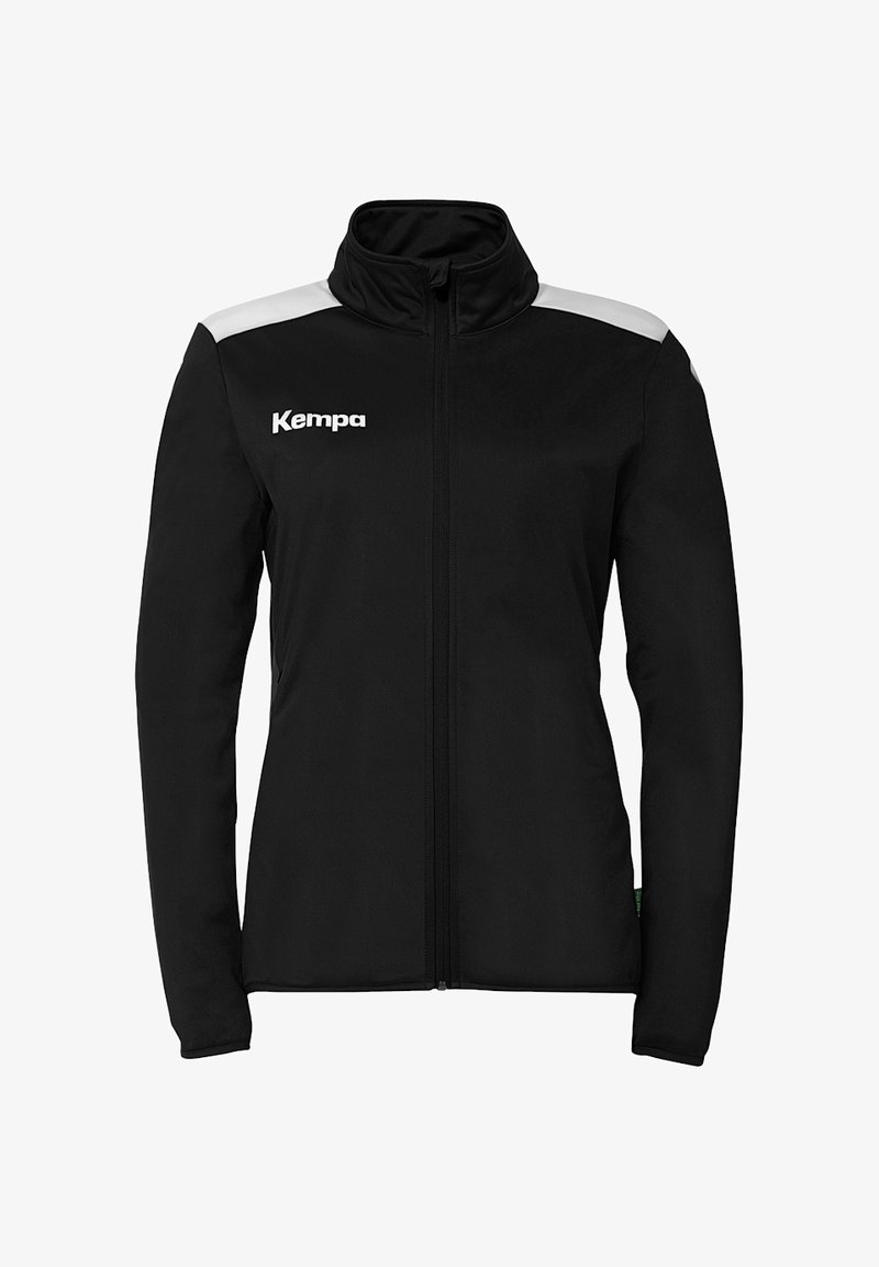 Schwarze Jacke mit hohem Kragen, Reißverschluss und weißen Akzenten an den Schultern. Mit "Kempa"-Logo auf der Brust. Glatte Stoffstruktur.