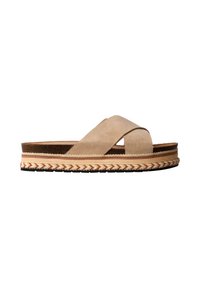 Sandale beige en daim avec brides croisées, semelle plateforme épaisse à motifs avec détails tissés et semelle extérieure noire crantée.