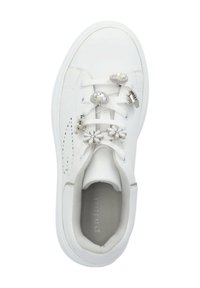 White sneaker featuring a smooth synthetic upper, decorative flower and gemstone accents on the laces, with a cushioned interior.